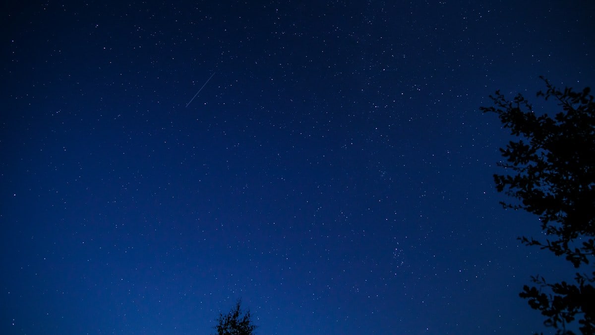 a blue sky with stars